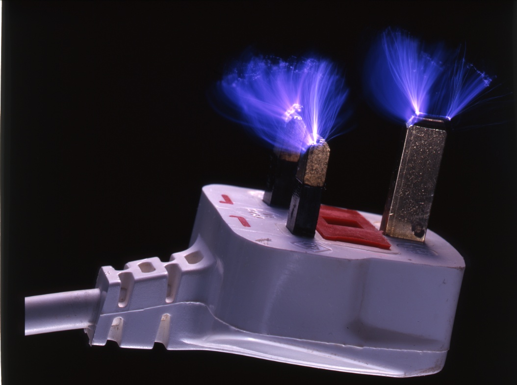 electrical-discharge-in-multiple-sparks-from-prongs-pins-of-uk-electric-mains-plug-3-prong-fuse-carrier-in-base-rescan-rescan-ajhd.jpg