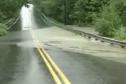 flooded-river-takes-out-road.jpg